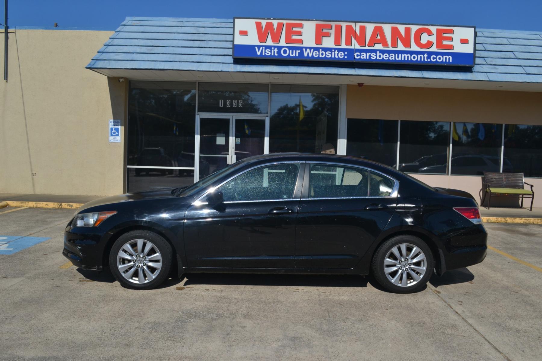 2011 Crystal Black Pearl /Ivory Leather Interior Honda Accord EX-L Sedan AT with Navigation (1HGCP2F83BA) with an 2.4L L4 DOHC 16V engine, 5-Speed Automatic transmission, located at 1355 North 11th Street, Beaumont, 77702, (409) 832-0006, 30.094290, -94.130096 - Photo #1