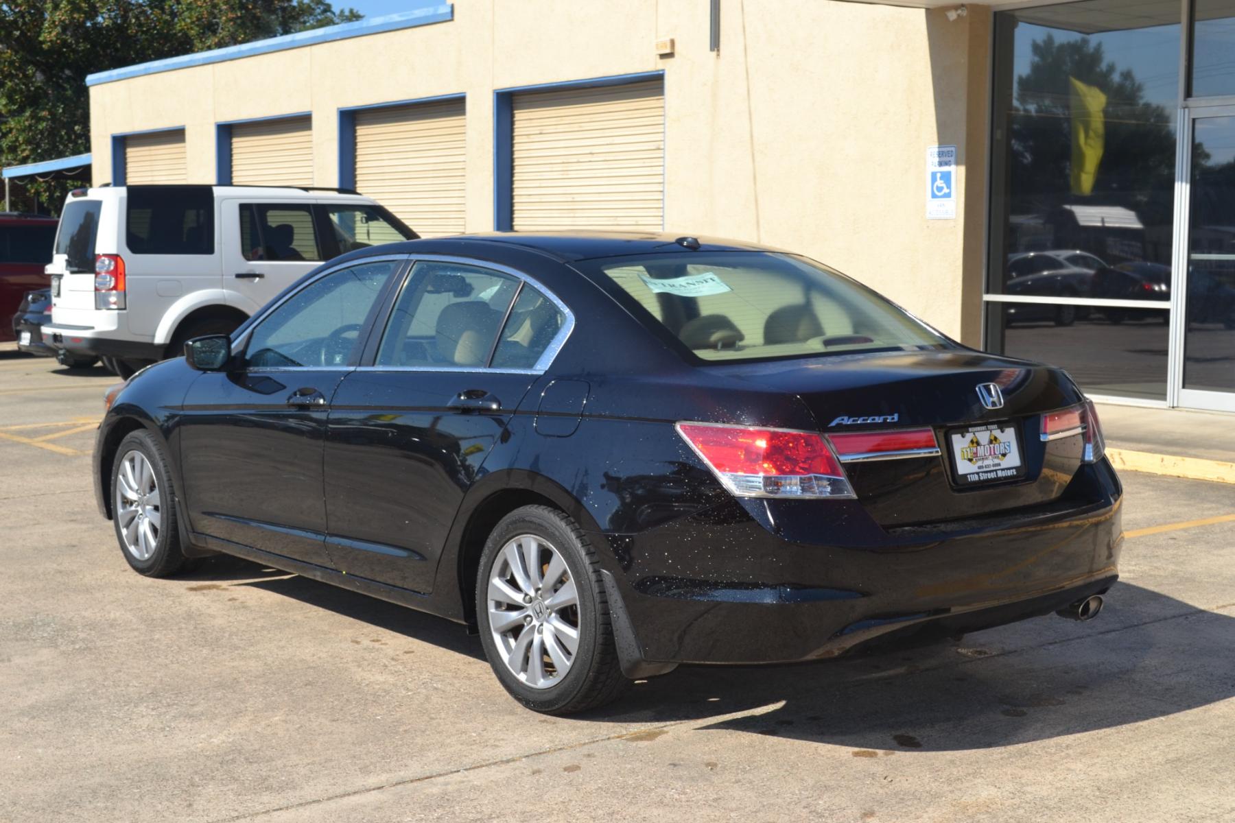 2011 Crystal Black Pearl /Ivory Leather Interior Honda Accord EX-L Sedan AT with Navigation (1HGCP2F83BA) with an 2.4L L4 DOHC 16V engine, 5-Speed Automatic transmission, located at 1355 North 11th Street, Beaumont, 77702, (409) 832-0006, 30.094290, -94.130096 - Photo #2