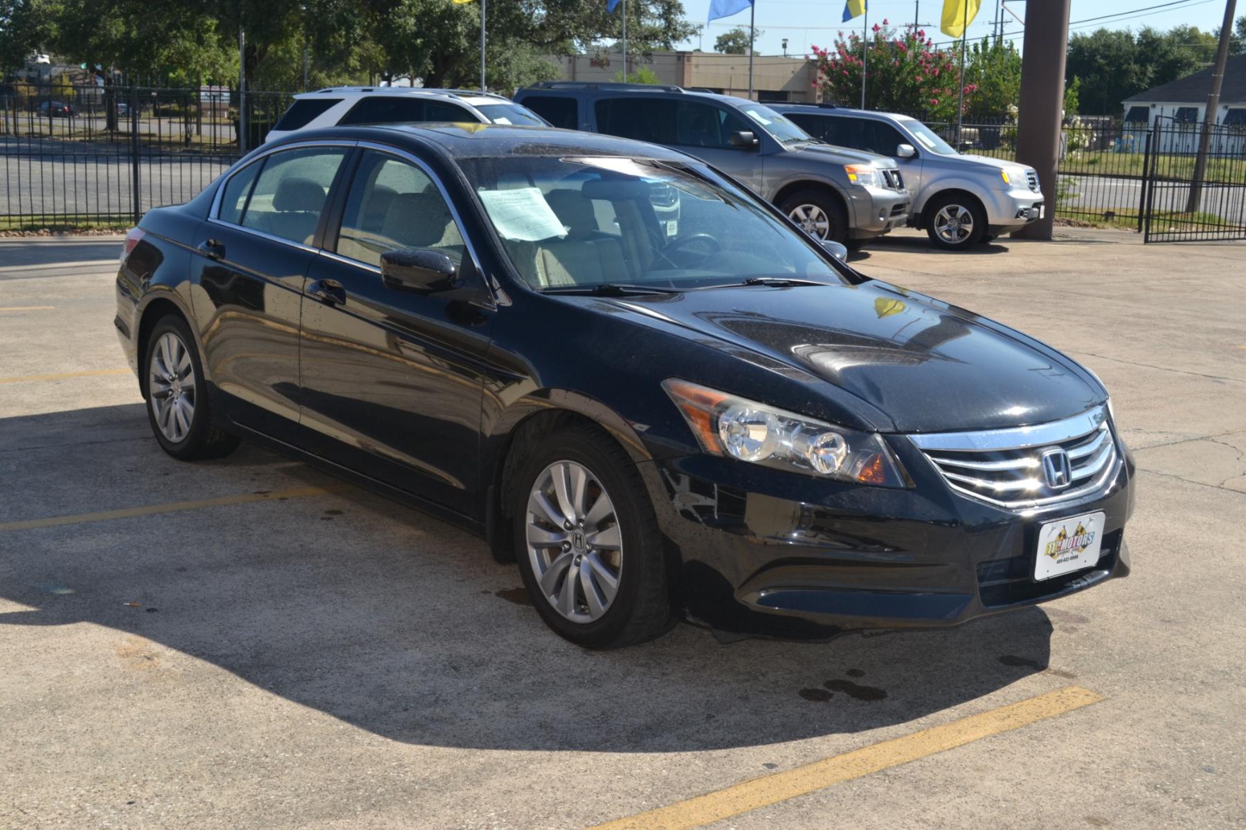 2011 Crystal Black Pearl /Ivory Leather Interior Honda Accord EX-L Sedan AT with Navigation (1HGCP2F83BA) with an 2.4L L4 DOHC 16V engine, 5-Speed Automatic transmission, located at 1355 North 11th Street, Beaumont, 77702, (409) 832-0006, 30.094290, -94.130096 - Photo #6