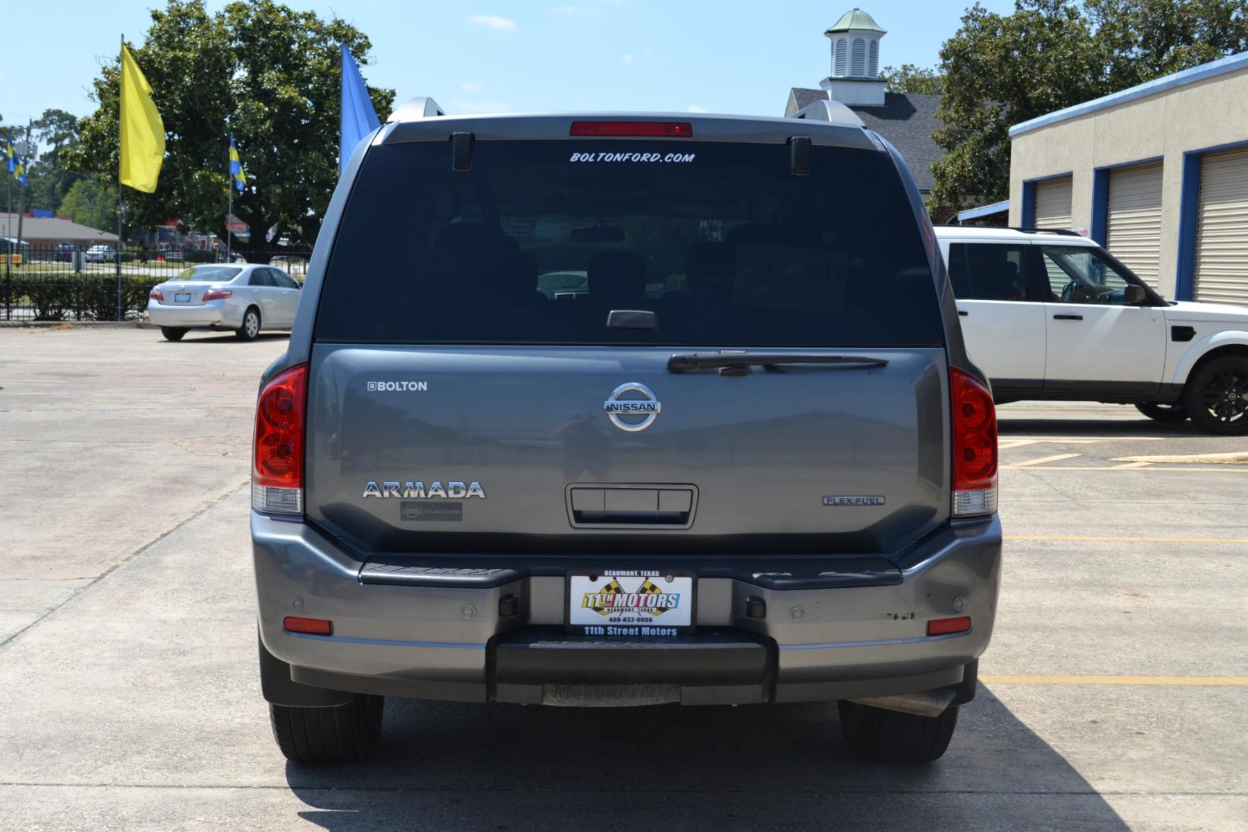 2013 Gun Metallic /Charcoal Nissan Armada SL 2WD (5N1BA0ND5DN) with an 5.6L V8 DOHC 32V FFV engine, 5-Speed Automatic transmission, located at 1355 North 11th Street, Beaumont, 77702, (409) 832-0006, 30.094290, -94.130096 - Photo #3